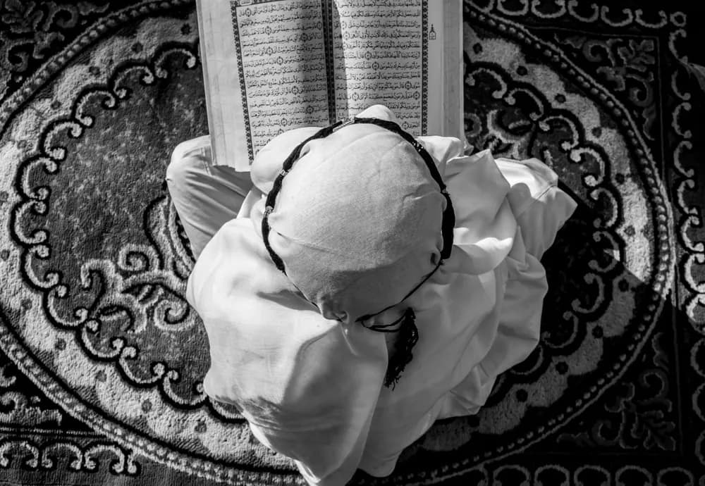 A young boy reading the Qur'an